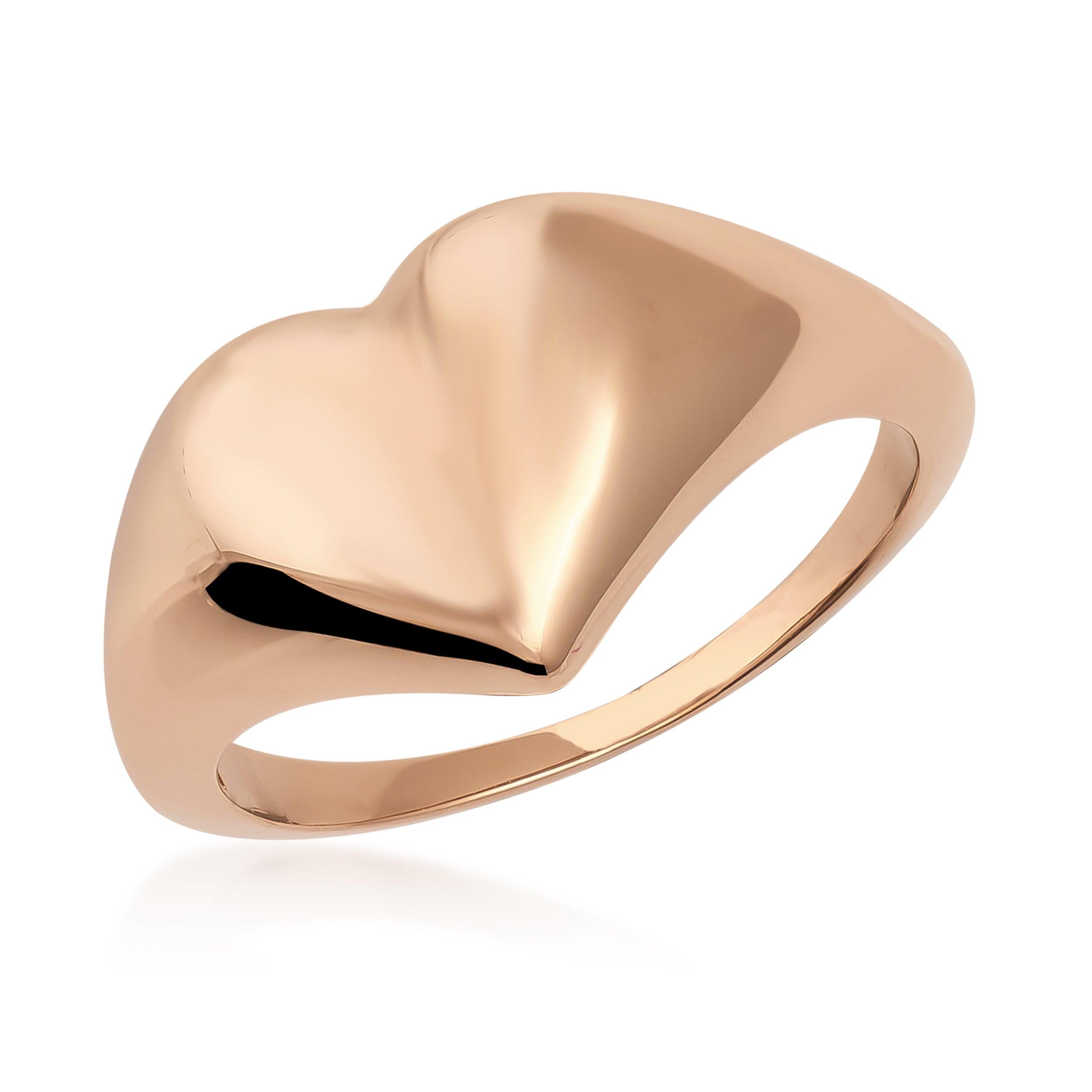 Polished gold heart-shaped ring with smooth, shiny finish on white background