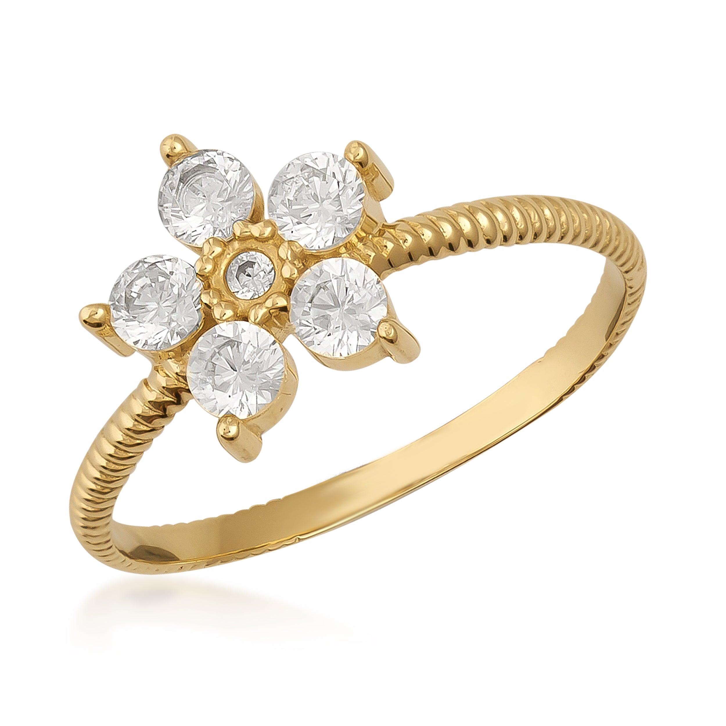Gold ring with six round-cut clear stones in a floral cluster design on textured band