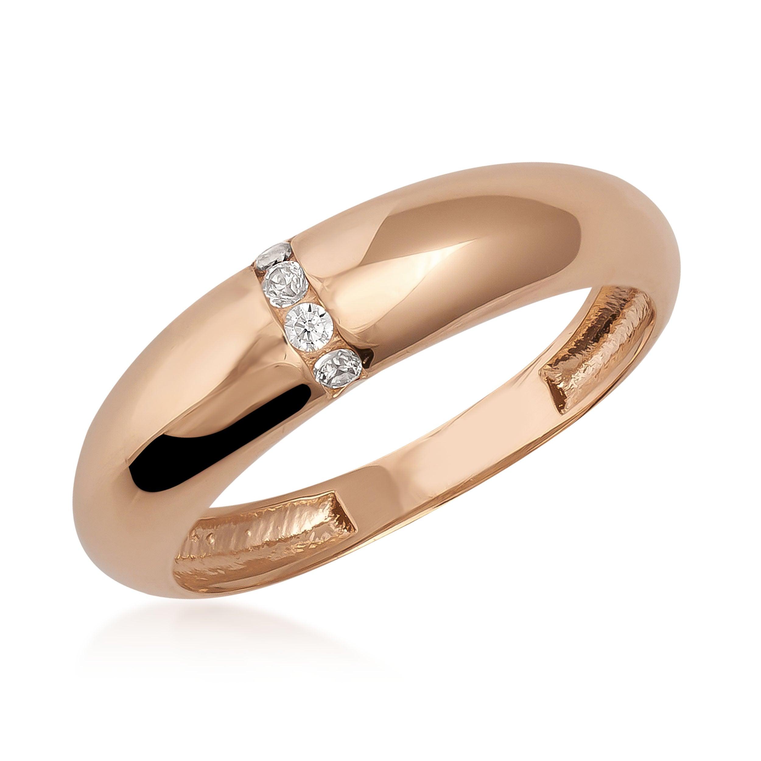 Polished gold ring with three small round diamonds set in a row on white background.