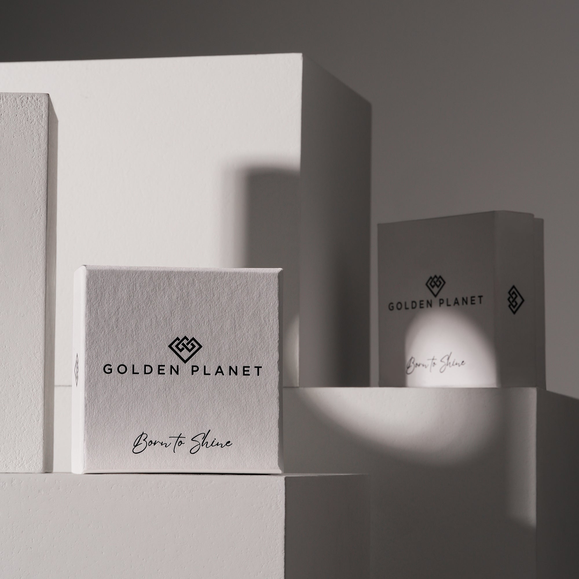 Two boxes with 'Golden Planet' branding on a gray background