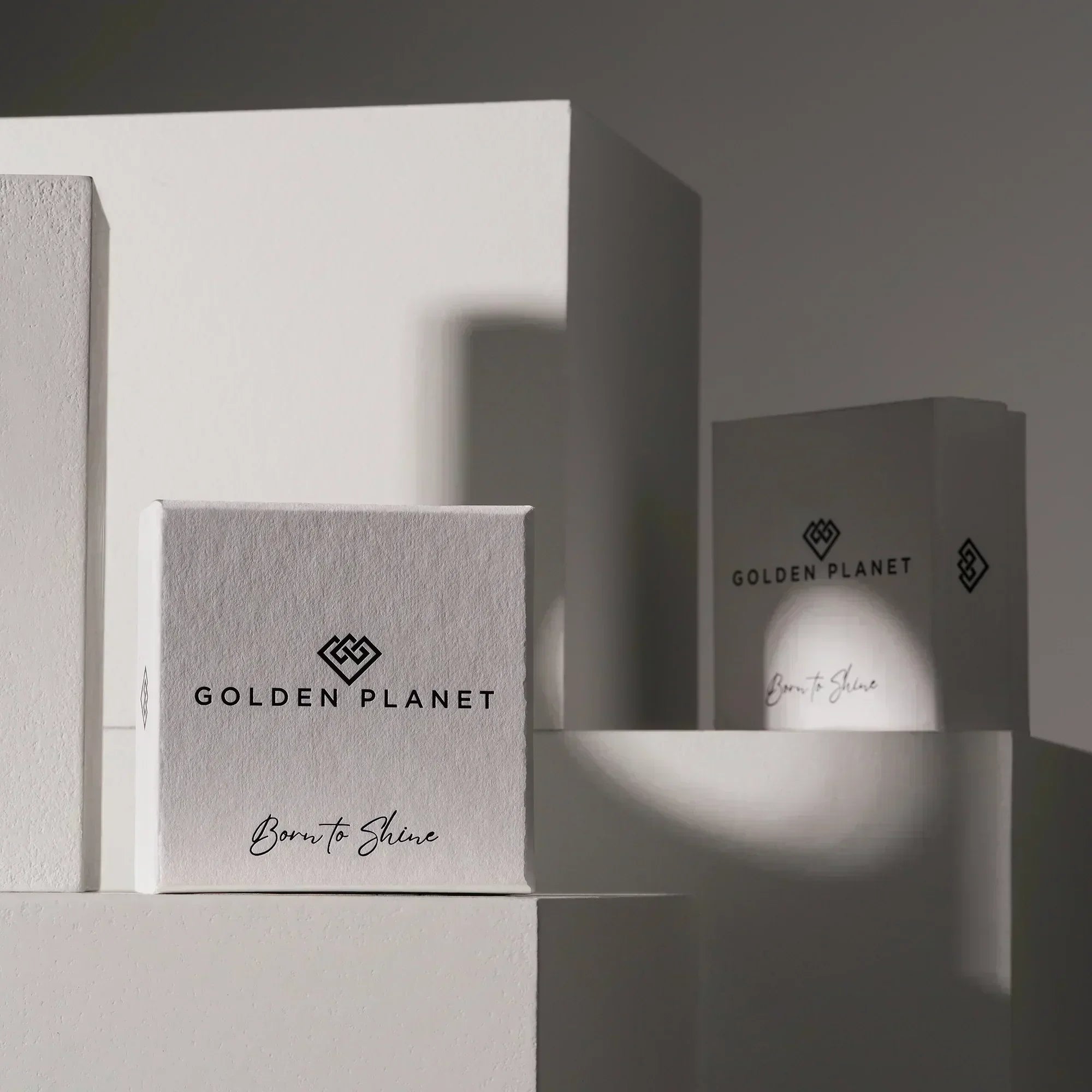 Two boxes with 'Golden Planet' branding on a gray background