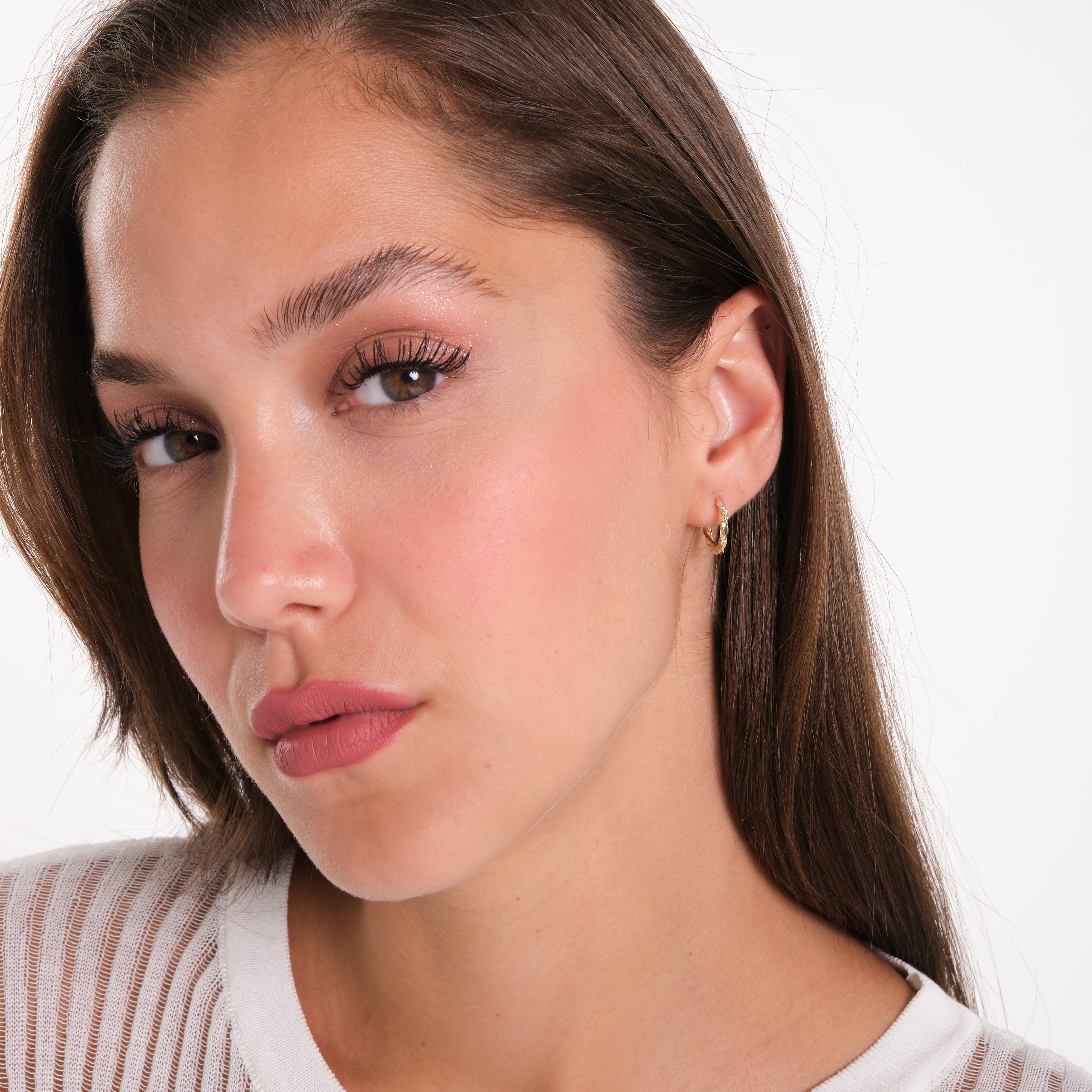 Close-up of a woman with a neutral background