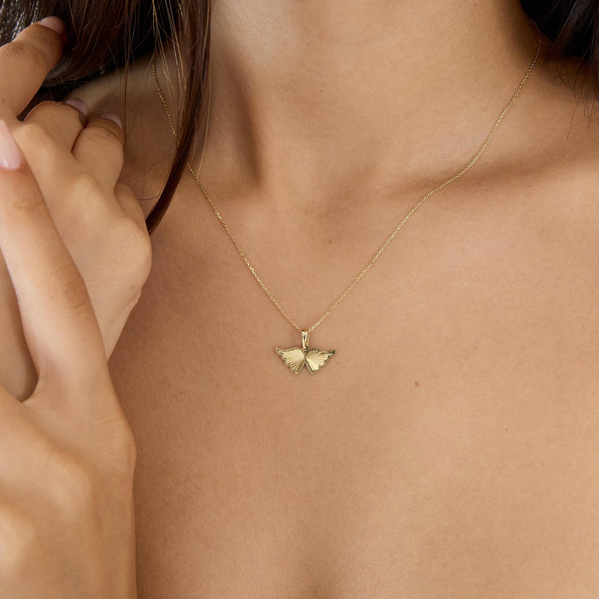 14K gold angel wing necklace, styled view