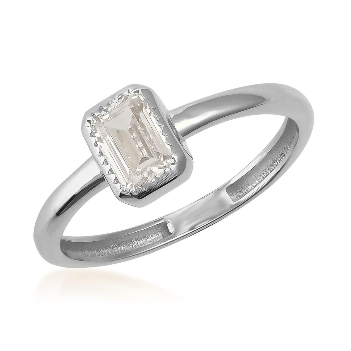 Emerald-cut solitaire cubic zirconia ring in 14K white gold with minimalist band on white background