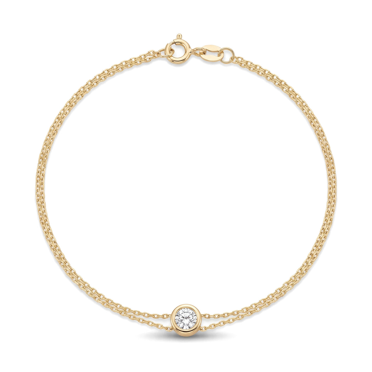 14K yellow gold bezel bracelet, double cable chain with one round bezel-set clear stone, on white