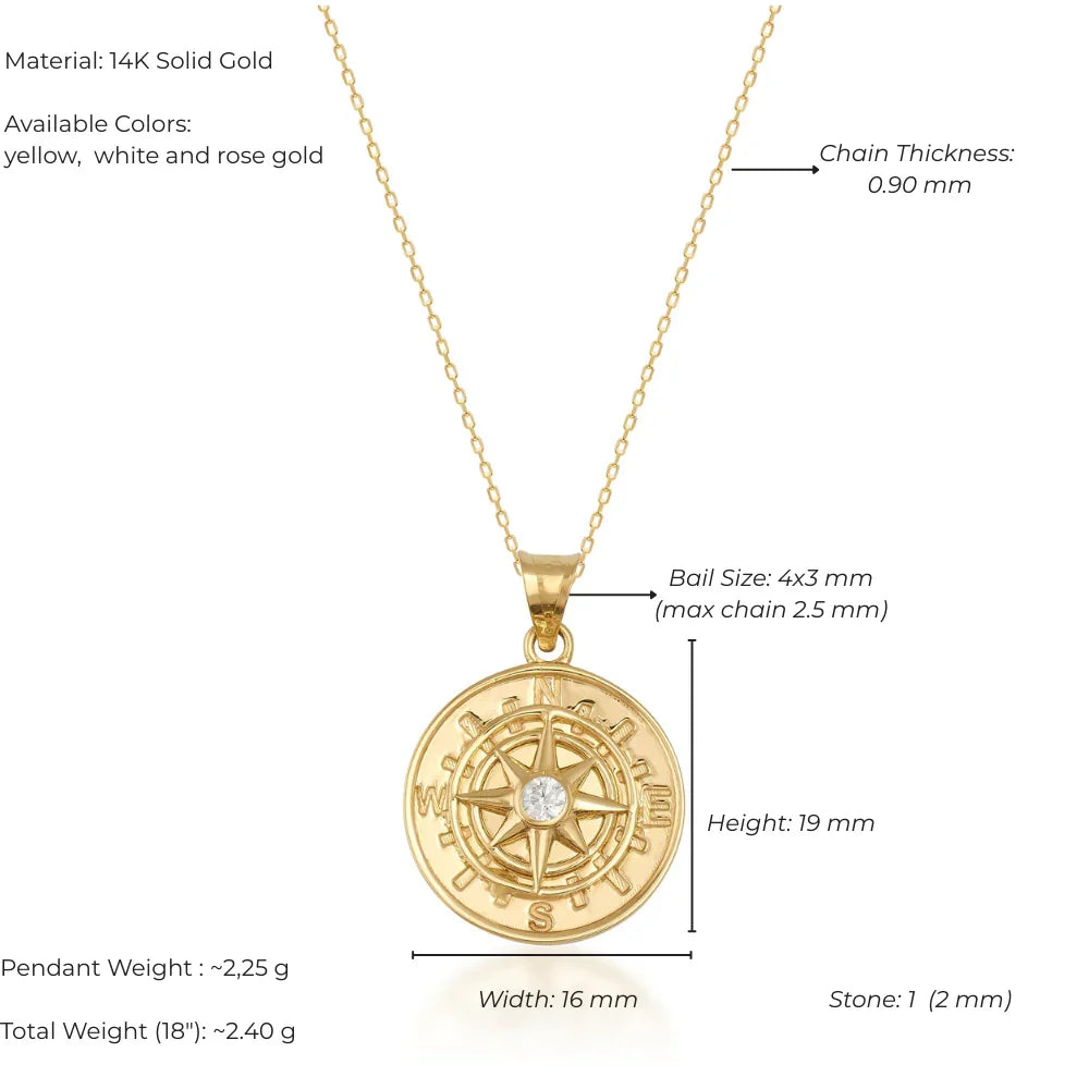 Gold compass pendant necklace with measurements and material details on a white background
