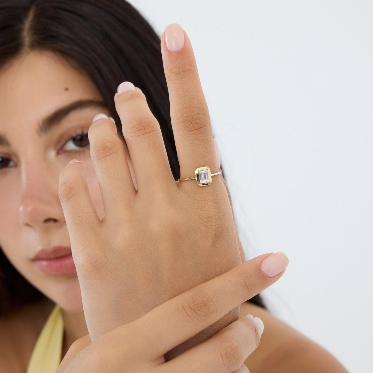14K gold emerald-cut cz solitaire ring, styled view
