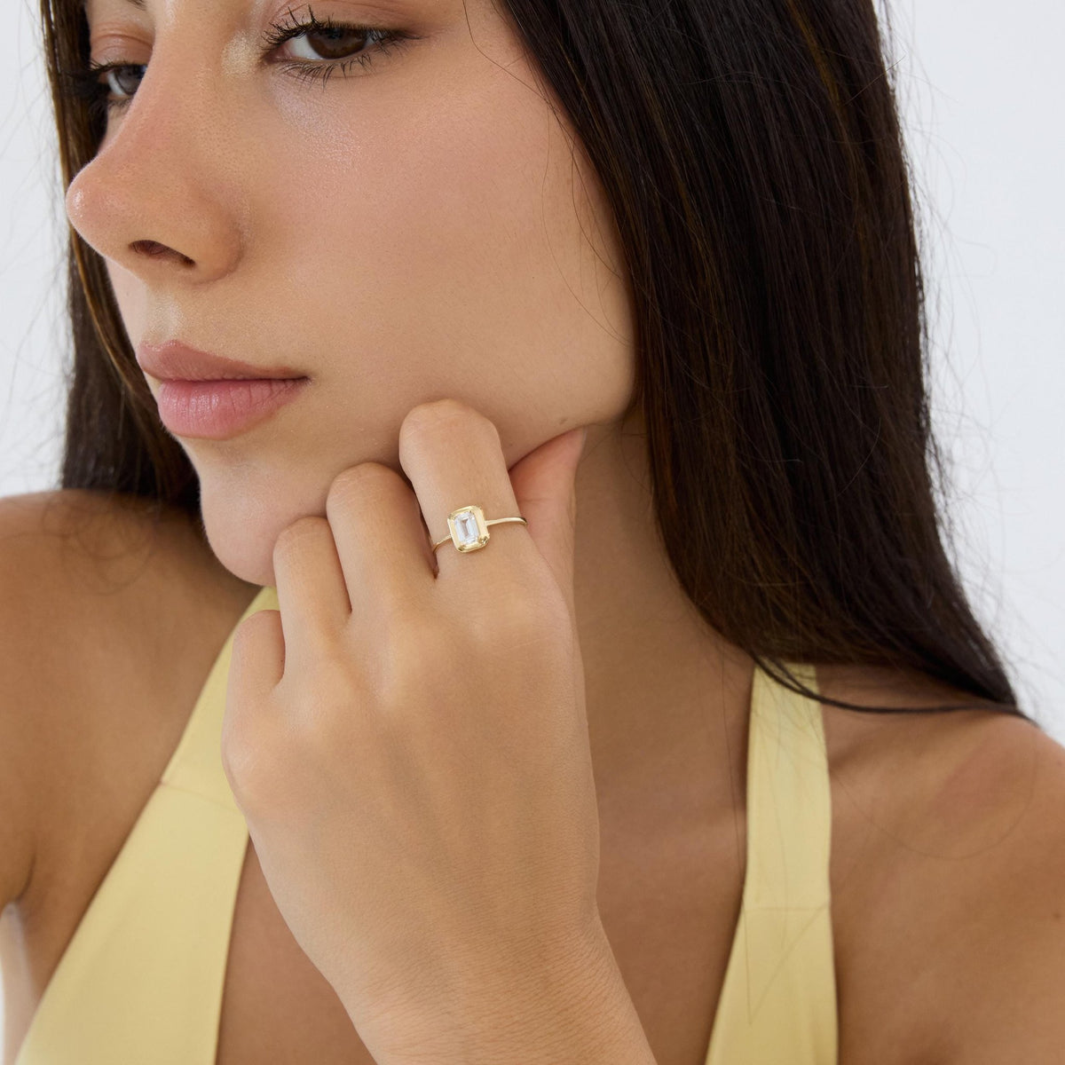14K gold emerald-cut cz solitaire ring, styled view