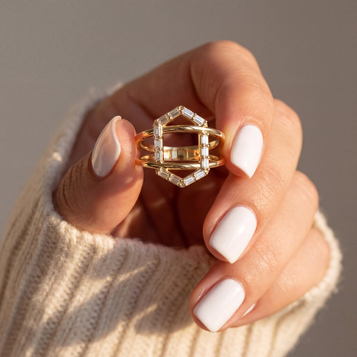 14K gold geometric baguette cz criss cross ring, styled view