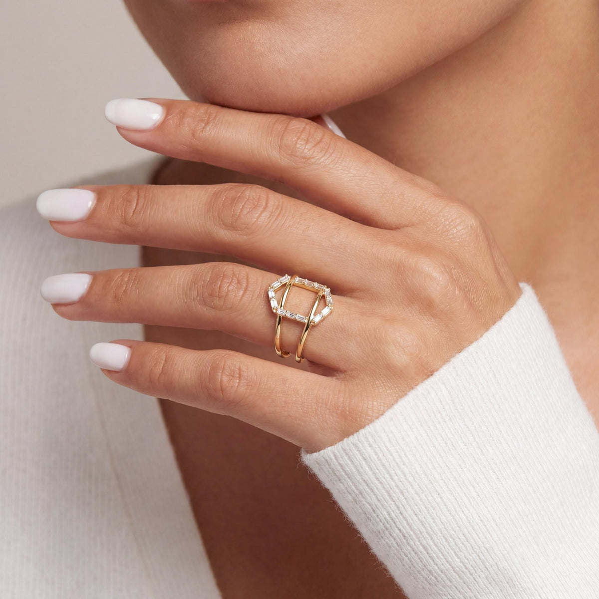 14K gold geometric baguette cz criss cross ring, styled view