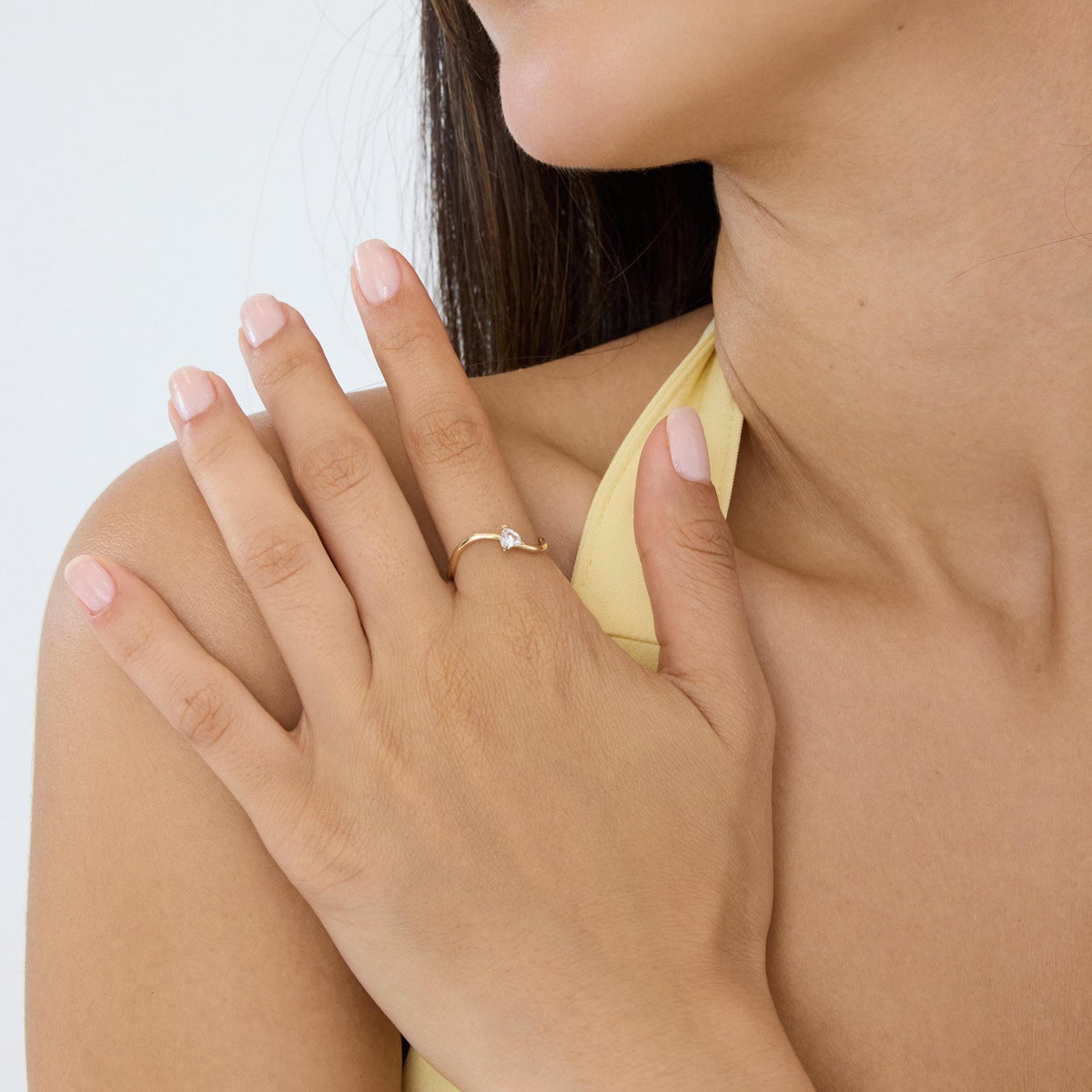 14K gold heart-shaped ring, styled view