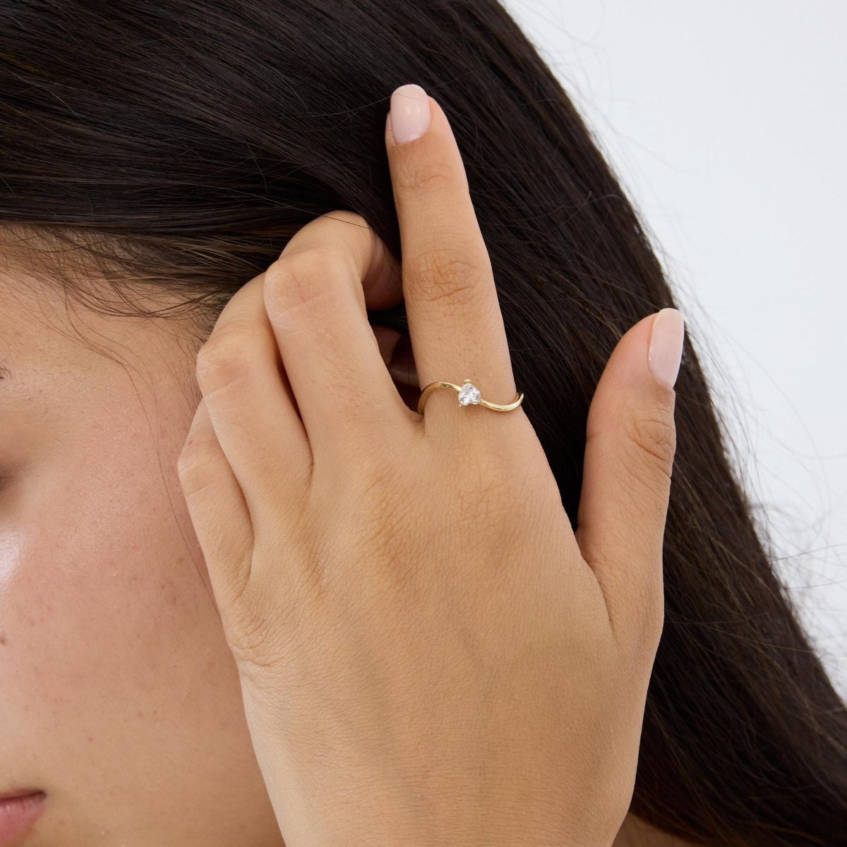 14K gold heart-shaped ring, styled view