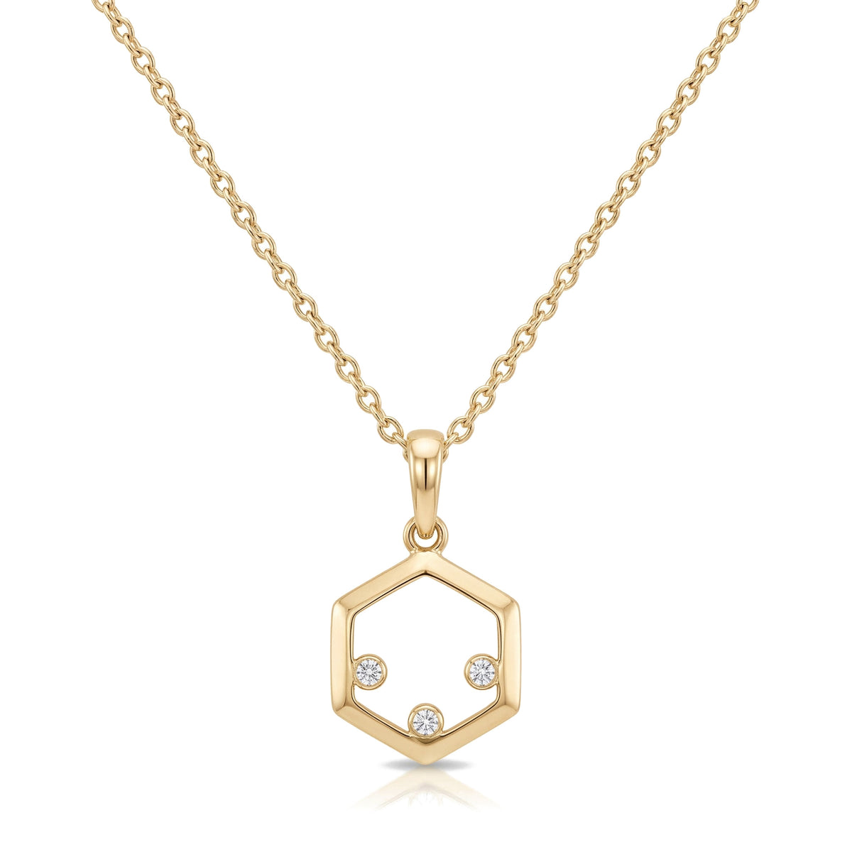 14K yellow gold hexagon necklace, open hexagon pendant with three zirconia stones, on white