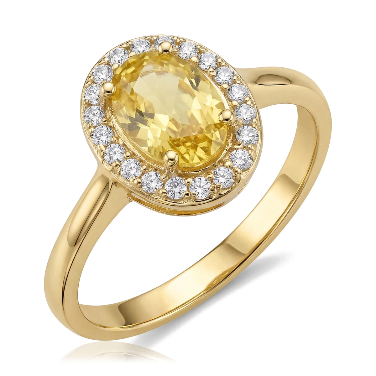 14K yellow gold simulated citrine ring, oval yellow stone in a halo of small clear stones, angled on white