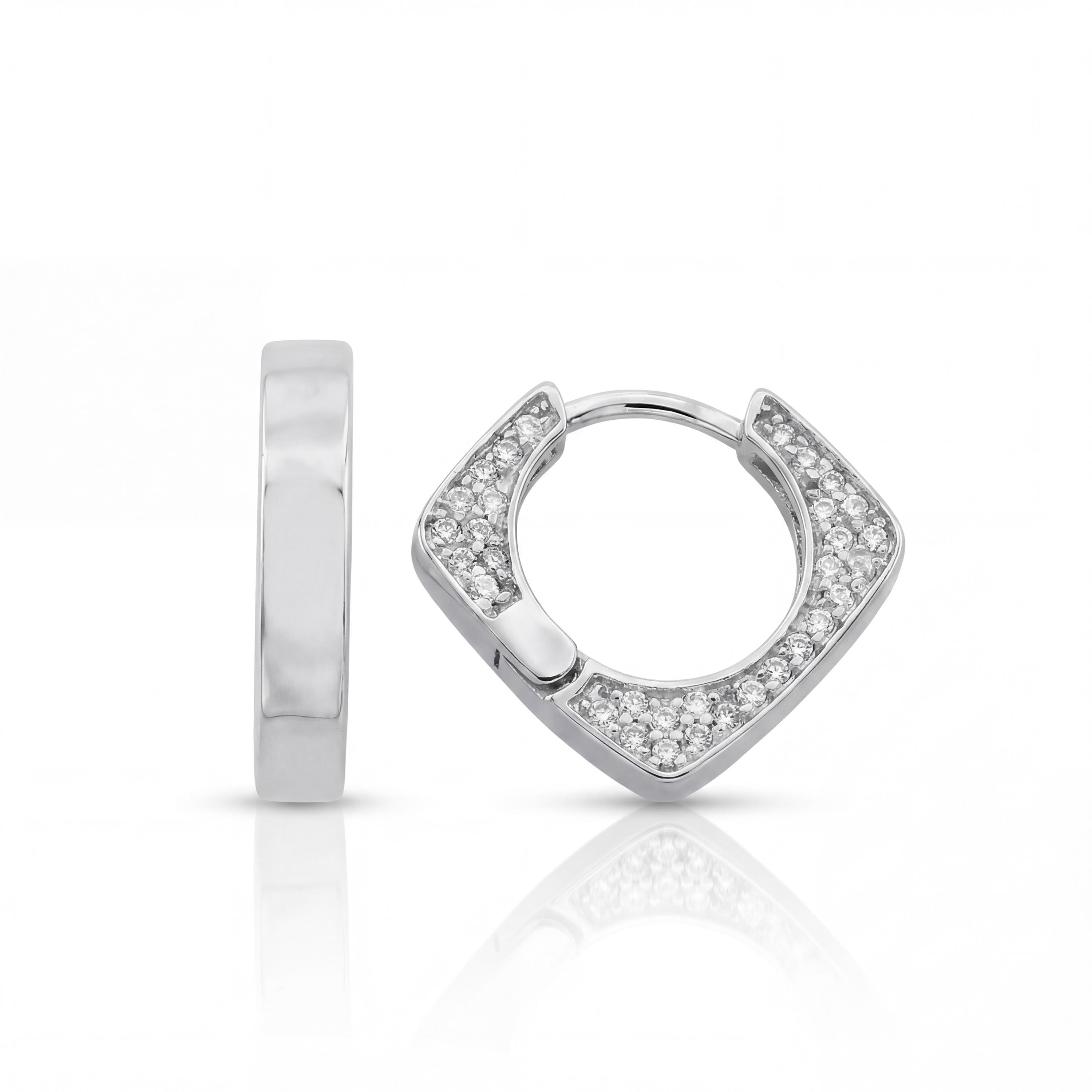 14K solid gold geometric huggie earrings, styled view