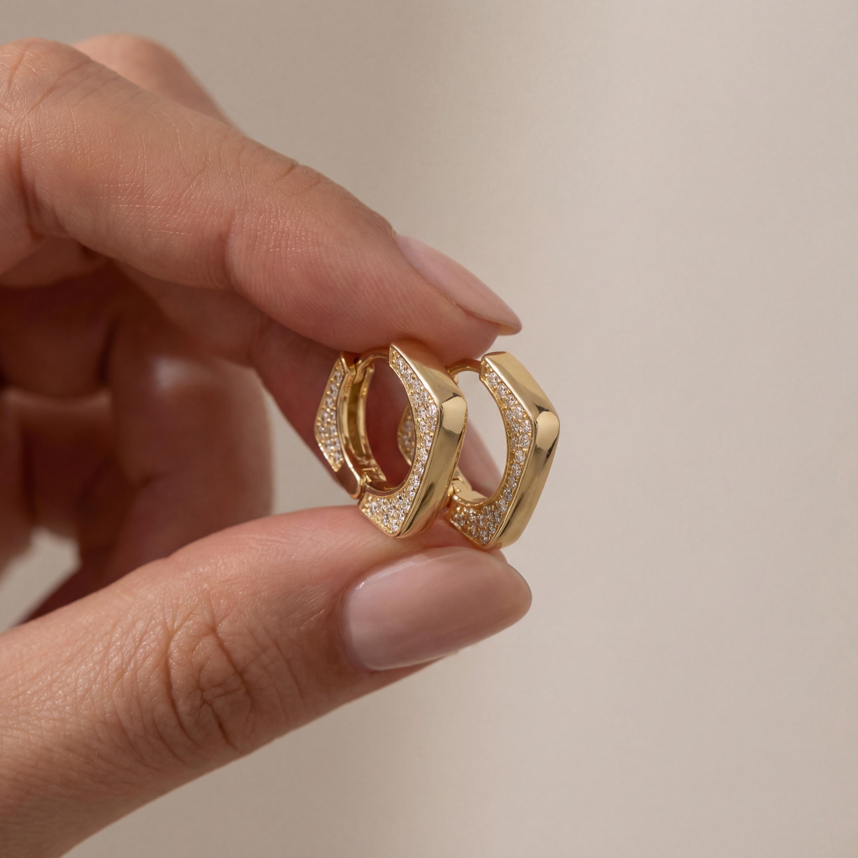 14K solid gold geometric huggie earrings worn