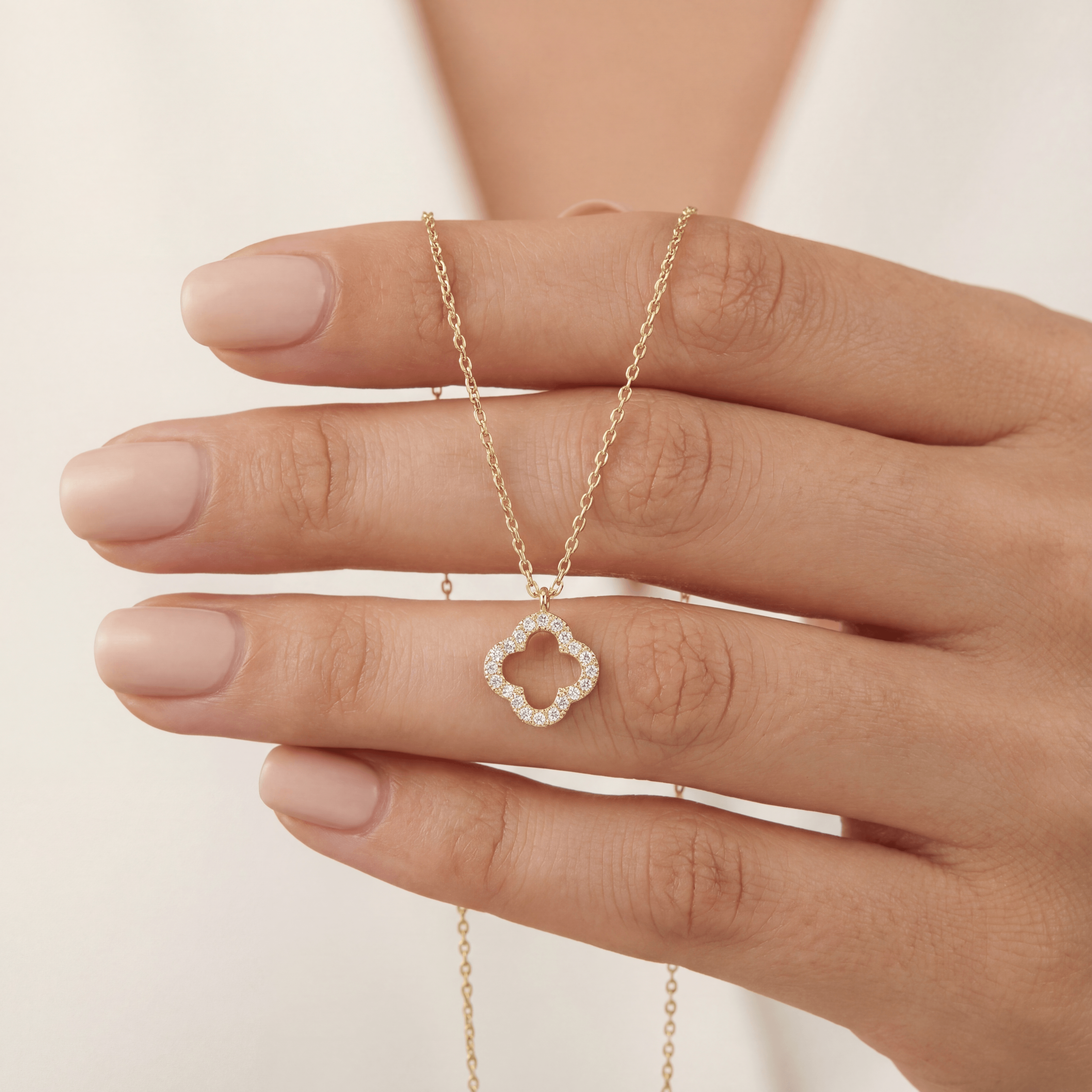 14K solid gold open quatrefoil clover necklace, close-up detail