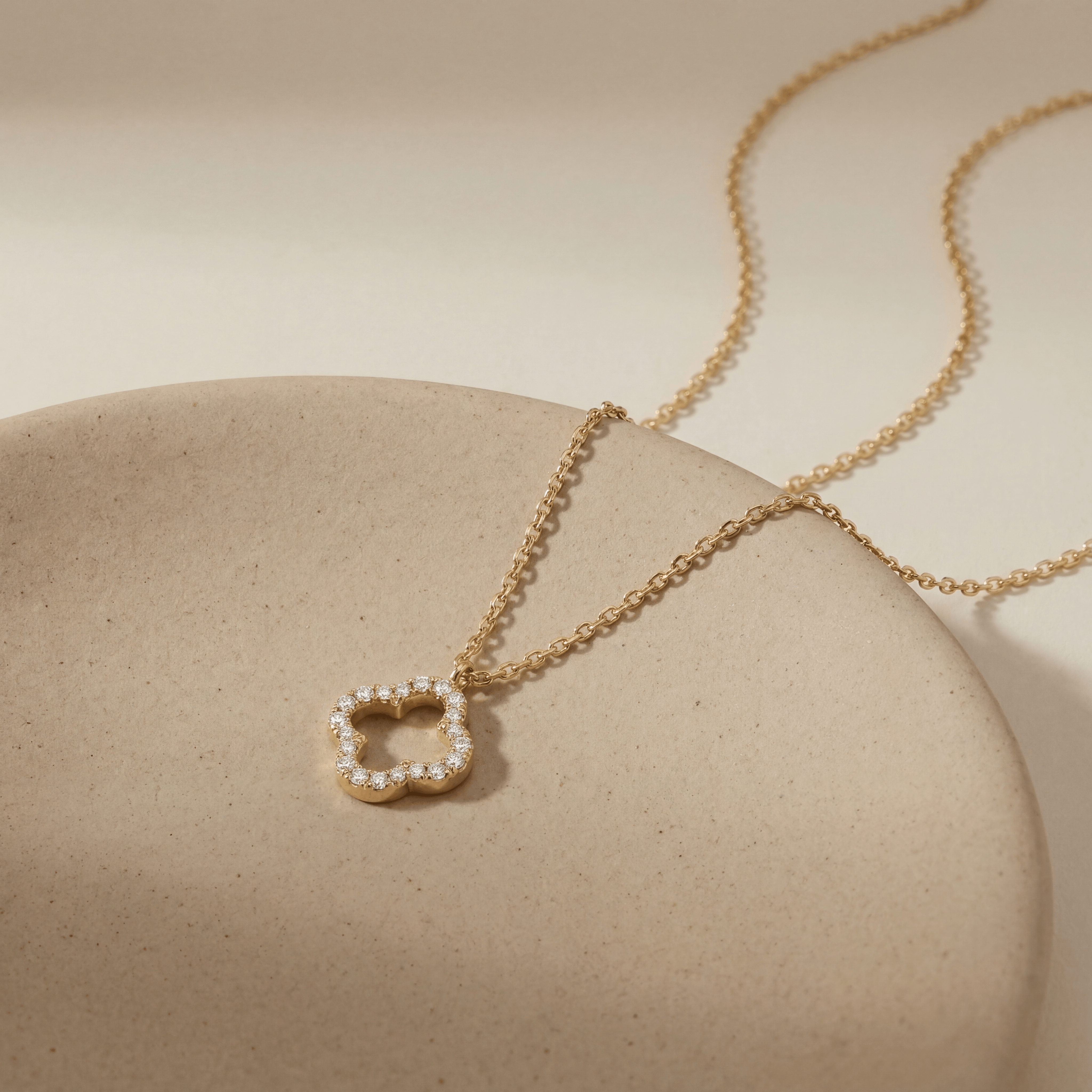14K solid gold open quatrefoil clover necklace with CZ stones, product photo