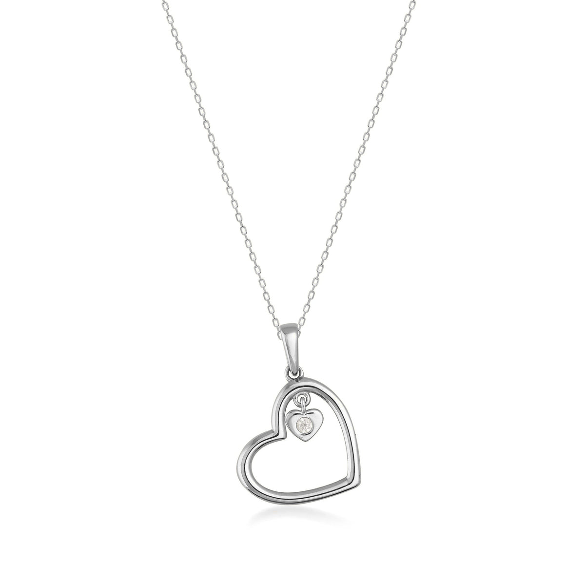 14K white gold heart pendant necklace with small cubic zirconia accent on plain background