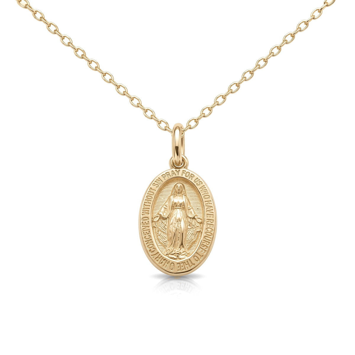 14K yellow gold Miraculous Medal necklace, oval medal with Virgin Mary relief and lettered border, on white