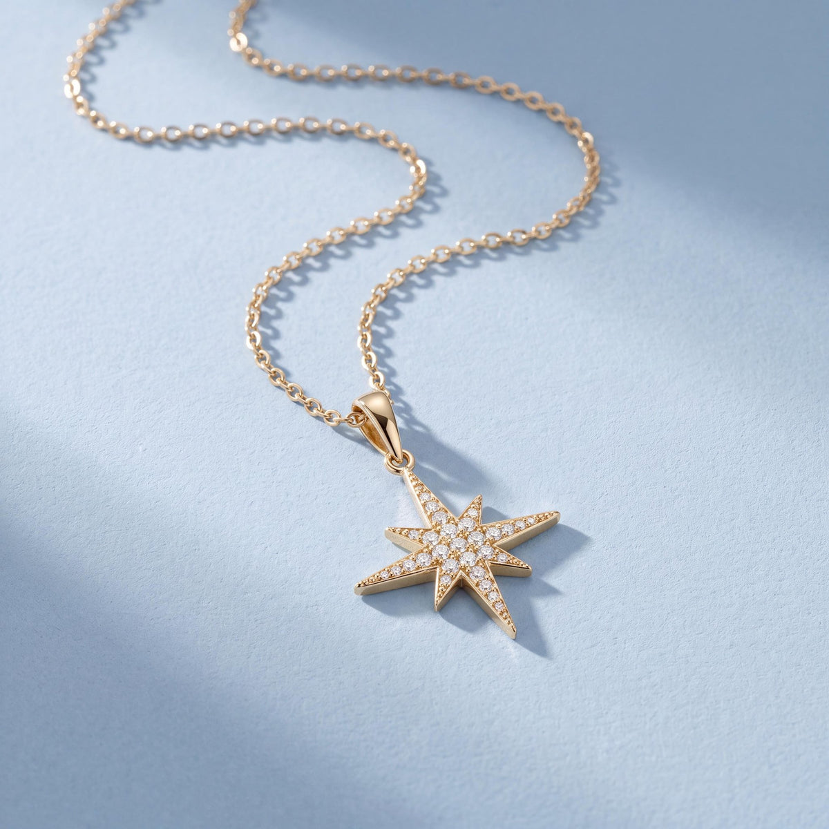 14K gold north star necklace, styled view