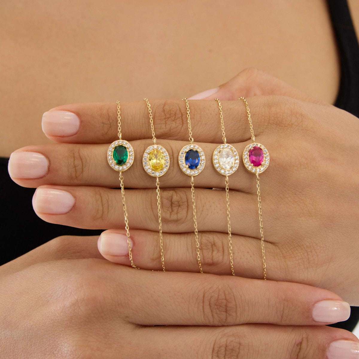 14K gold oval birthstone bracelet, styled view