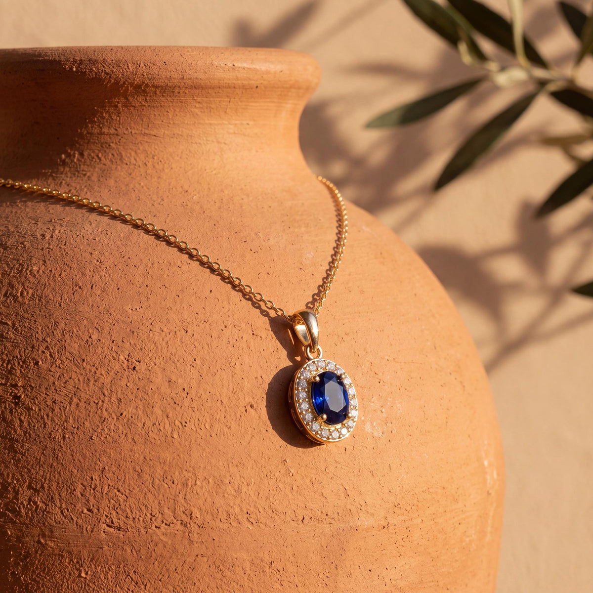 14K gold oval halo pendant necklace, styled view