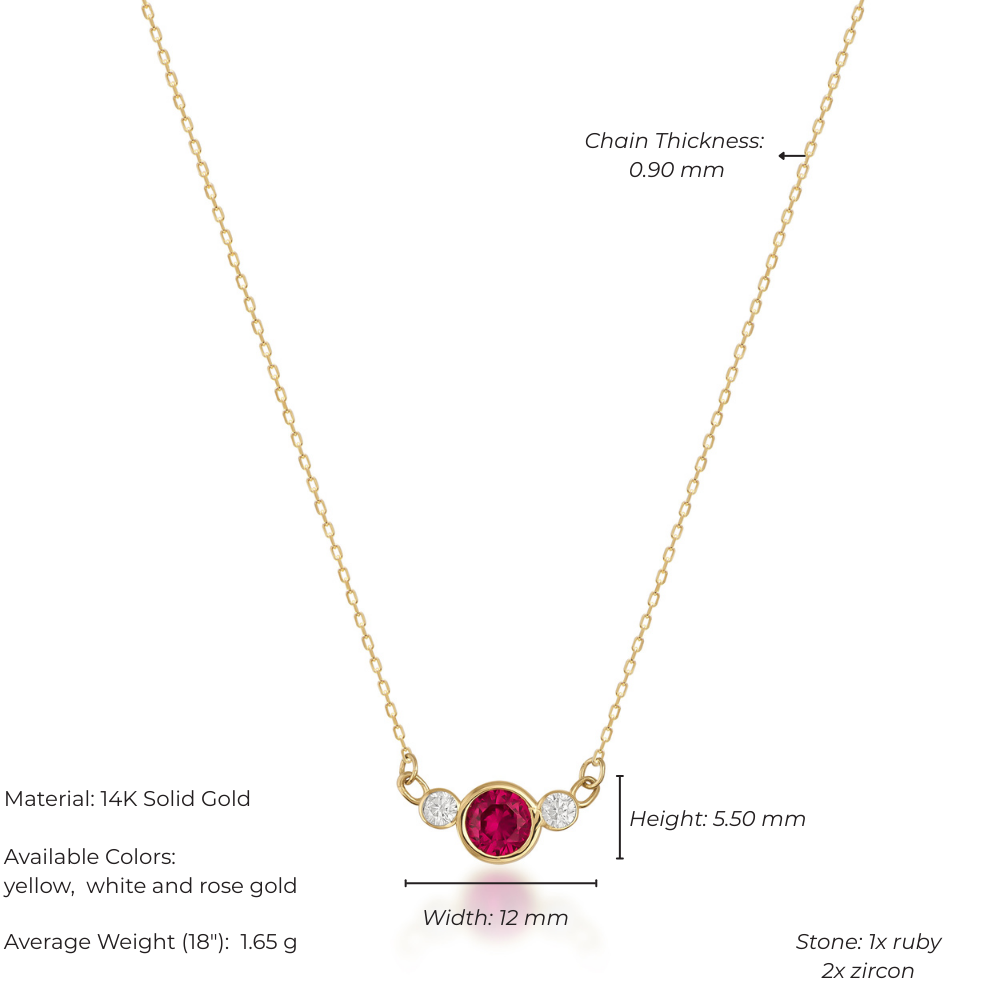 Gold necklace with a ruby and zircon stone on a white background