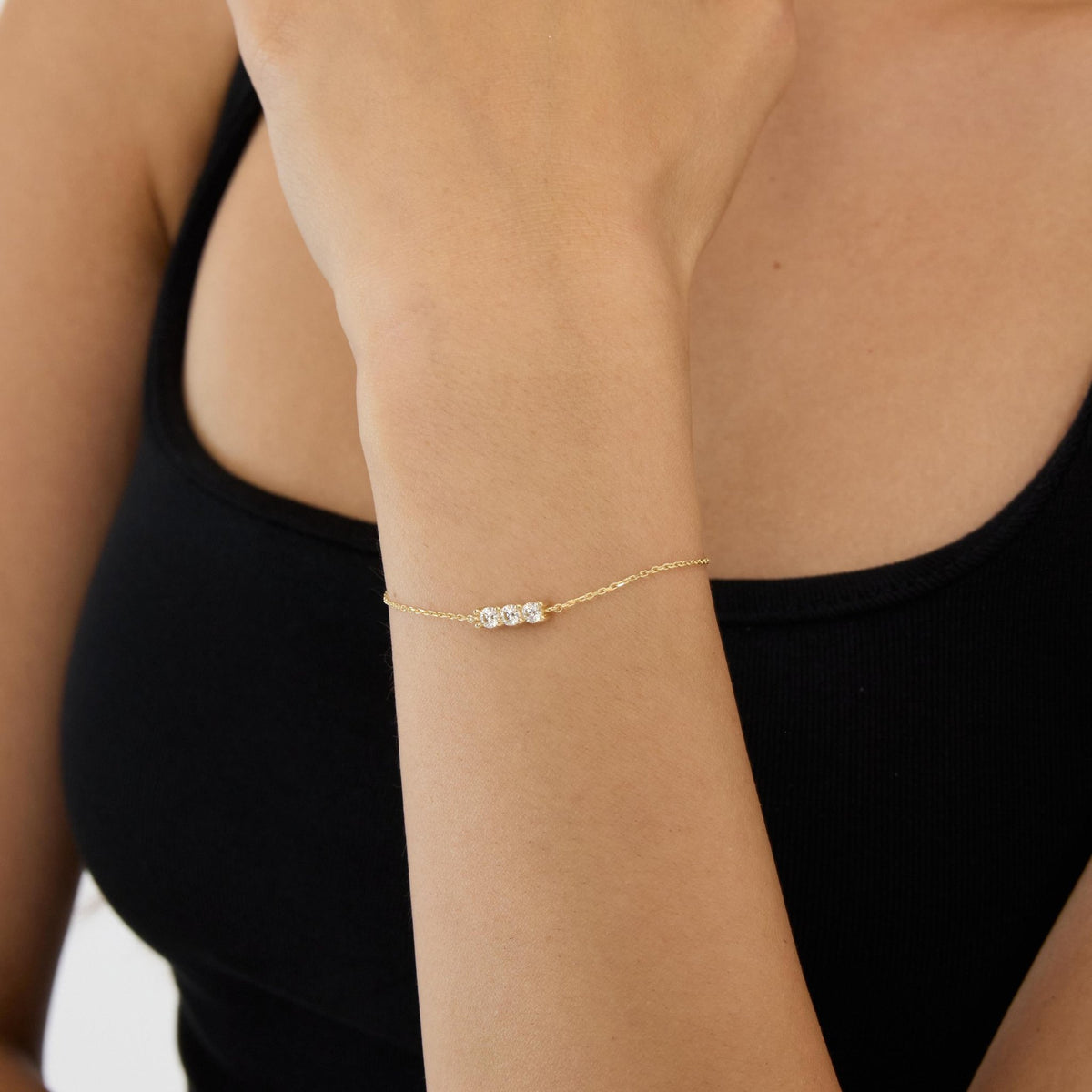 14K gold three stone bracelet, styled view
