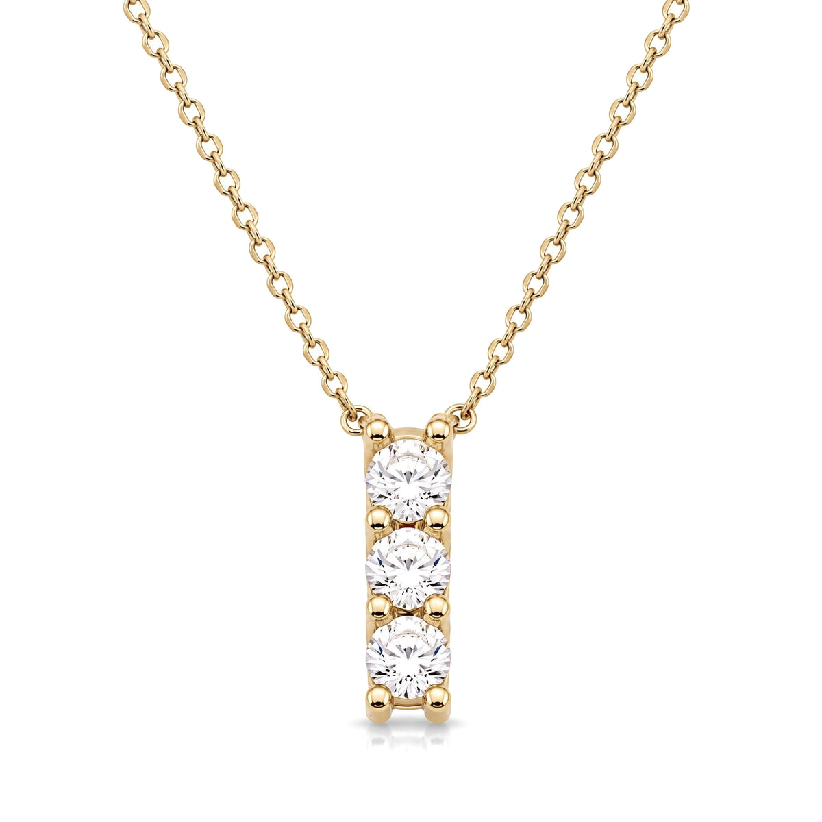 14K yellow gold three stone necklace, vertical bar pendant of three round cubic zirconia, on white