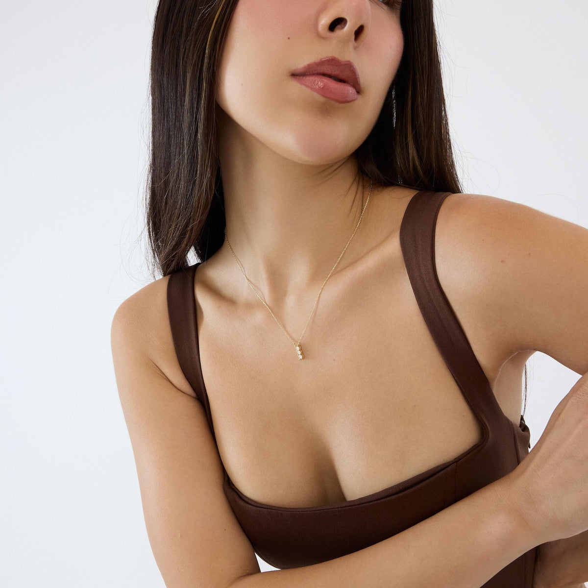 14K gold three stone necklace, styled view