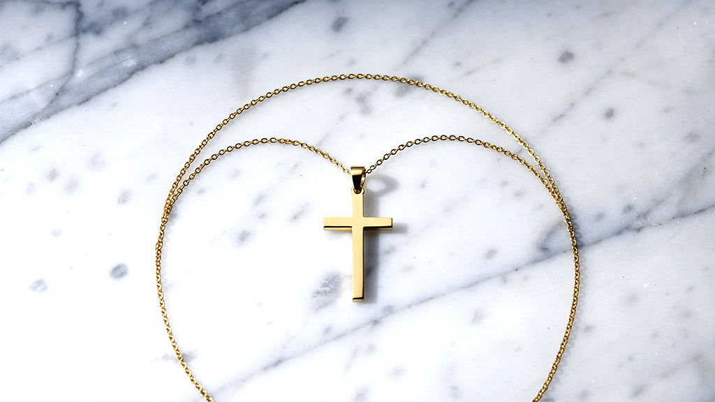 Small gold cross pendant necklace for women on a fine chain