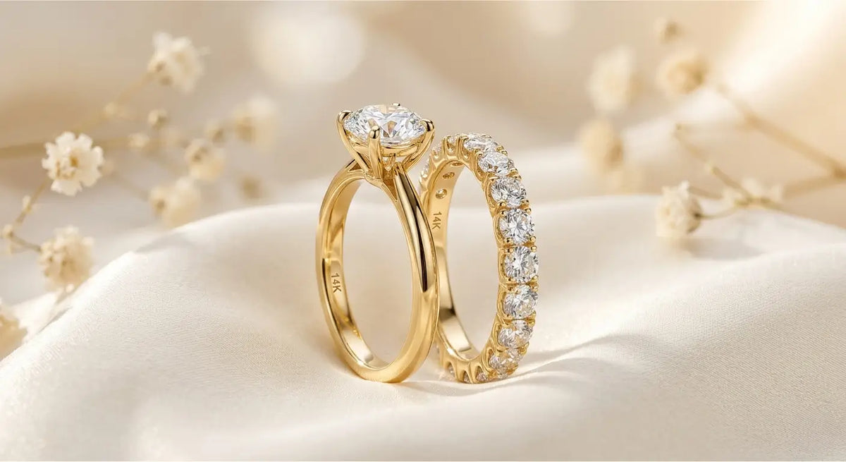 14K gold solitaire engagement ring paired with eternity wedding band on white background