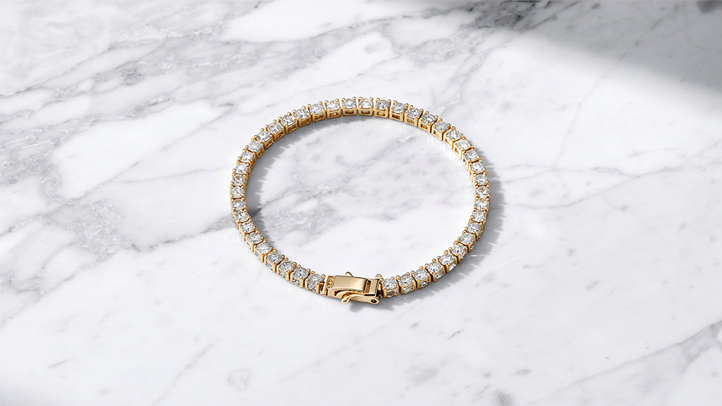 Gold tennis bracelet with a row of stones, shown to check if it is real
