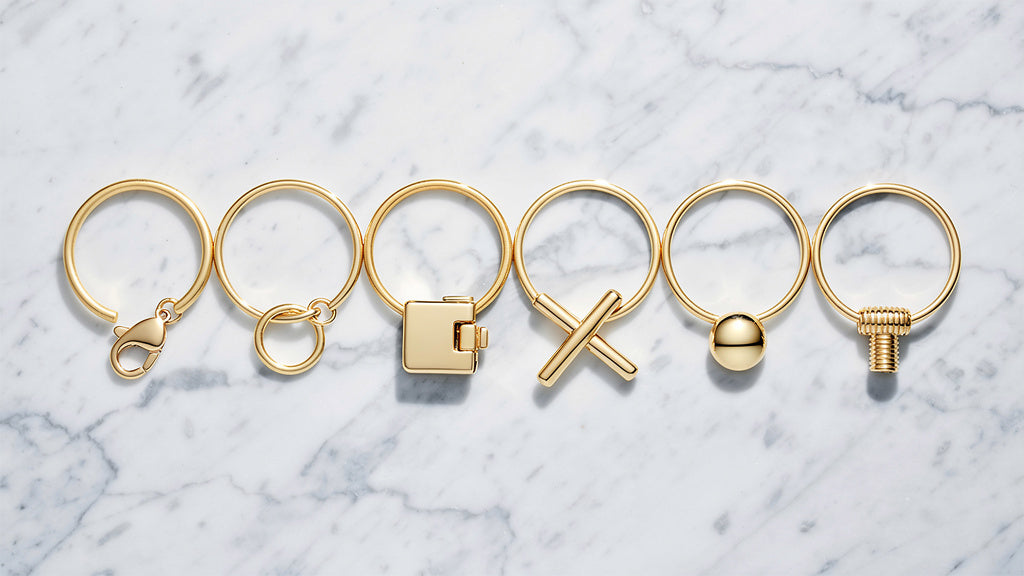 Gold bracelets showing different types of bracelet clasps side by side