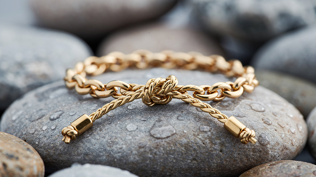 Gold bracelet with an adjustable sliding knot closure showing how to tie a bracelet