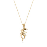 14K gold dolphin pendant necklace with cubic zirconia accent on a fine gold chain, jewelry product photo