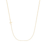 Delicate 14K gold necklace with sideways cross pendant on fine chain, minimalist jewelry