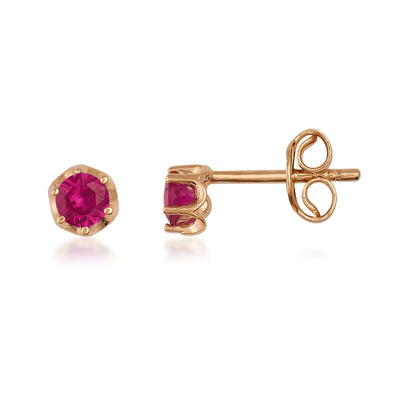 Gold stud earrings with round red gemstones in a prong setting, minimalist design