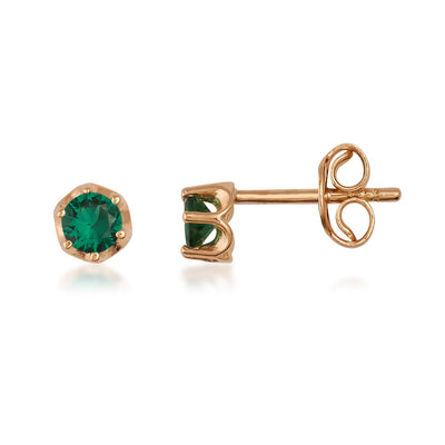 Gold stud earrings with round green gemstone on white background