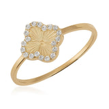 14K gold ring with four-leaf clover design and cubic zirconia accents on white background