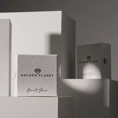 Two boxes with 'Golden Planet' branding on a gray background