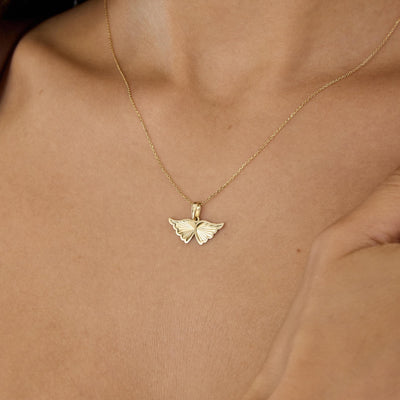 14K gold angel wing necklace, styled view