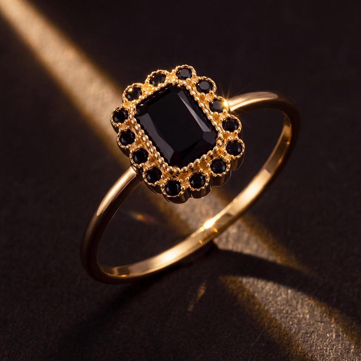 14K gold black cubic zirconia ring styled on a neutral backdrop
