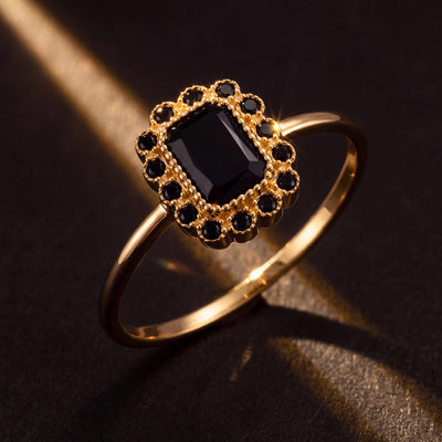 14K gold black cubic zirconia ring styled on a neutral backdrop