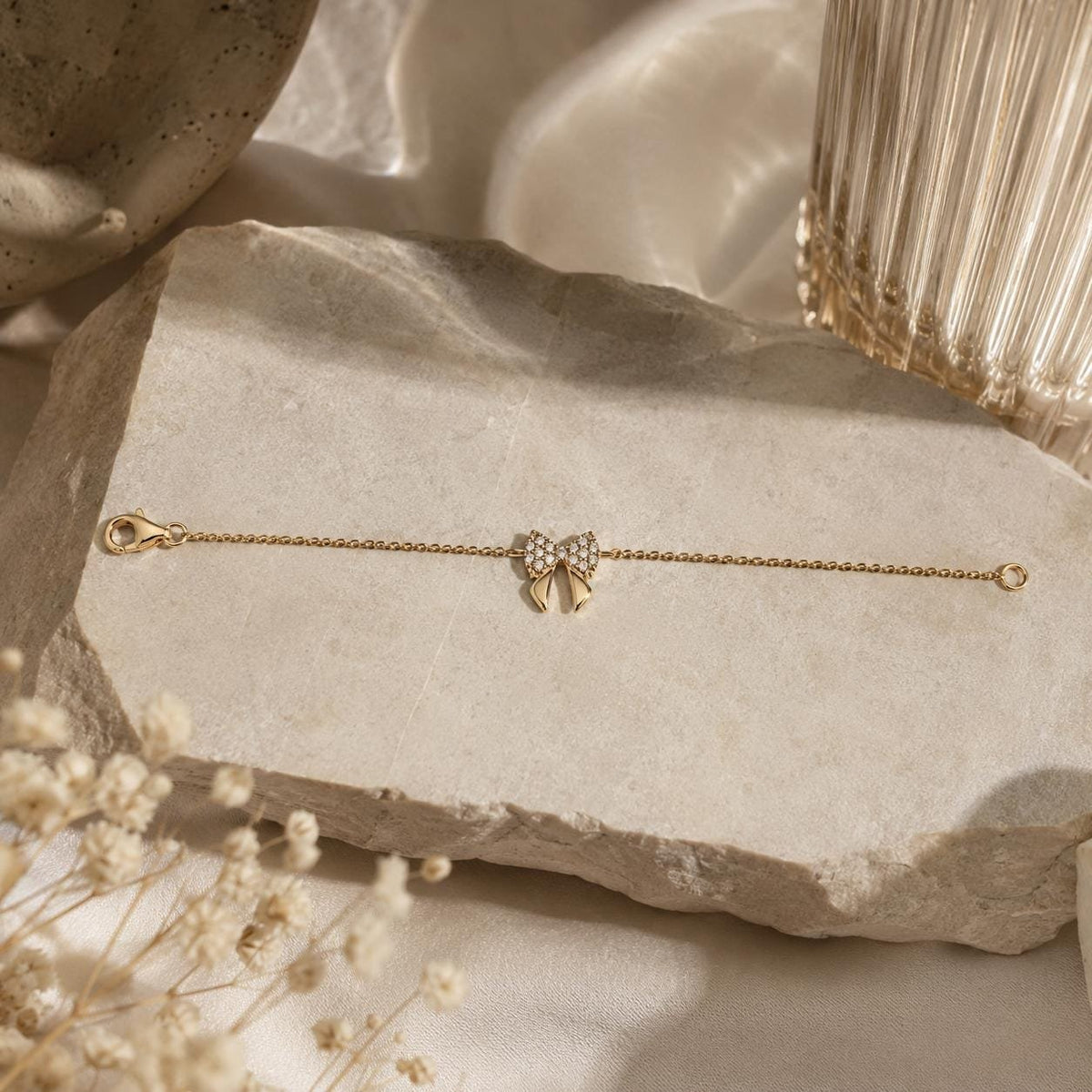14K gold bow bracelet, styled view