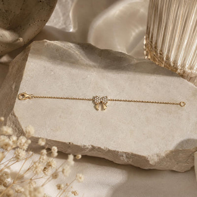 14K gold bow bracelet, styled view