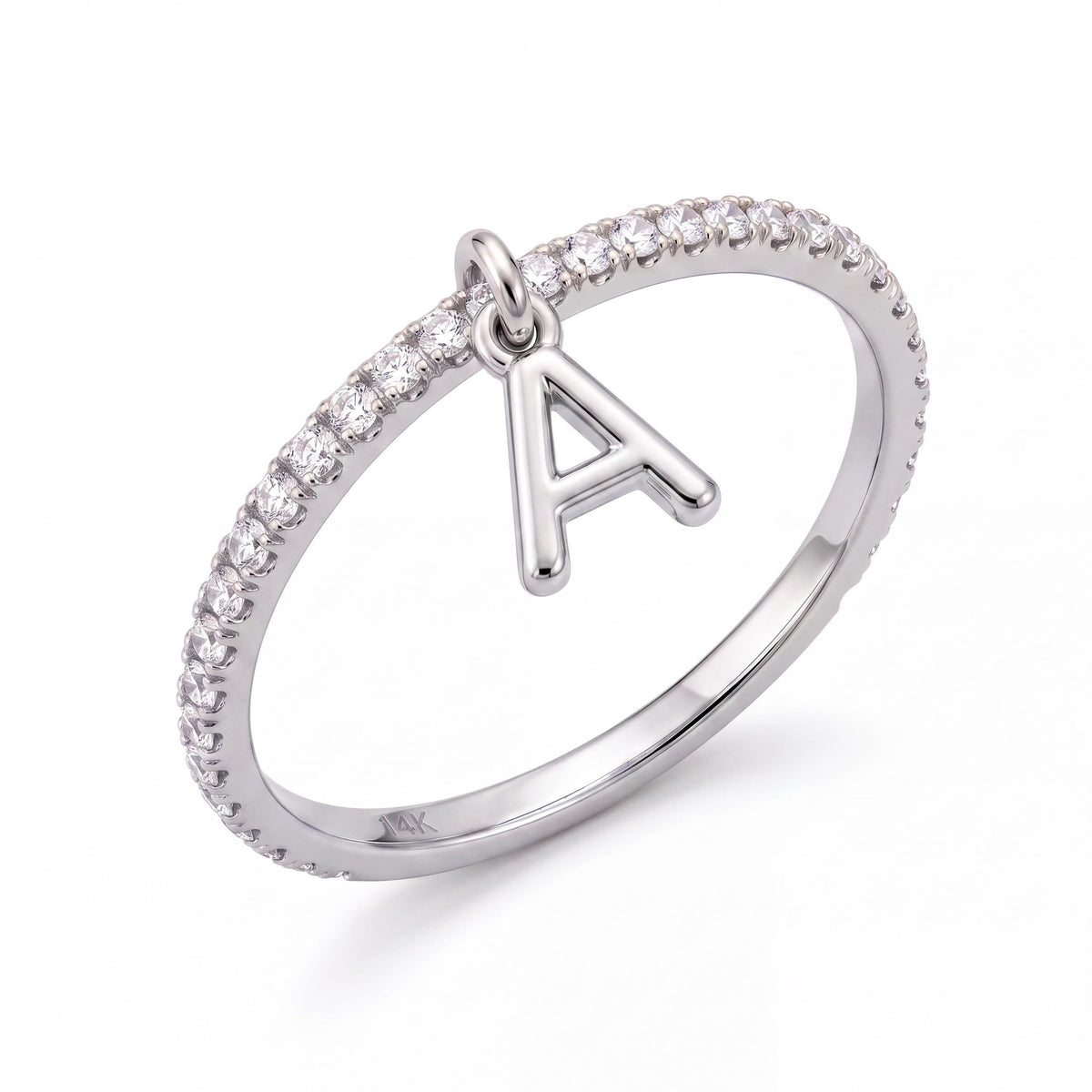 14K white gold dangle initial ring, thin clear stone pavé band with a hanging letter A charm, on white
