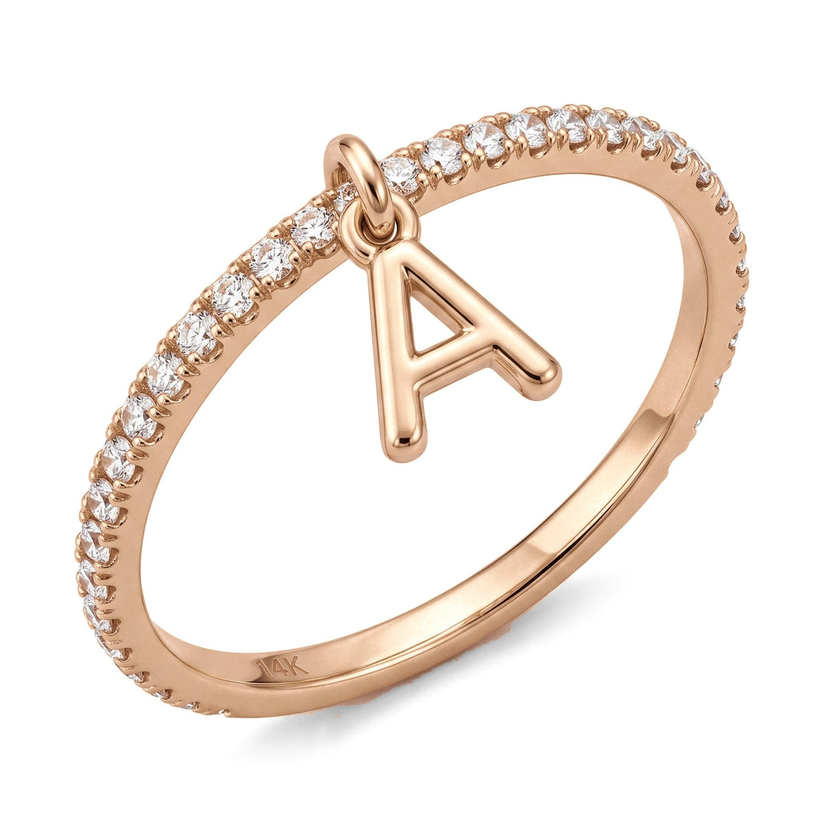14K rose gold dangle initial ring, thin clear stone pavé band with a hanging letter A charm, on white