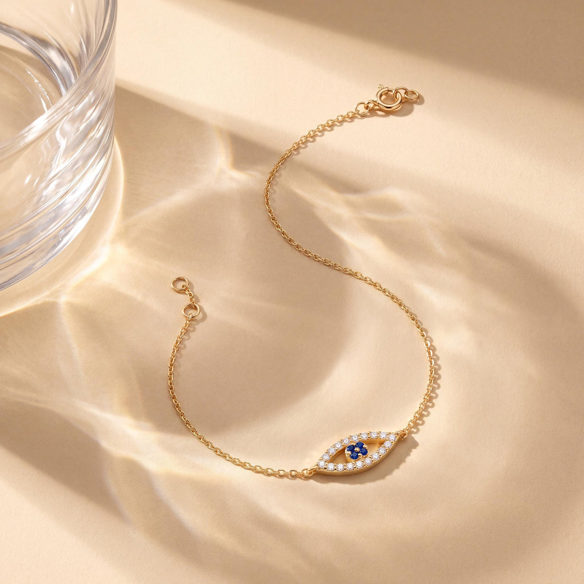 14K gold evil eye bracelet, styled view